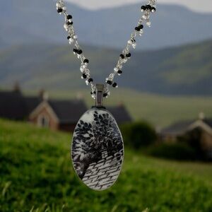 Artisan made broken china pendant. Wuthering Heights or Jane Austin vibe.